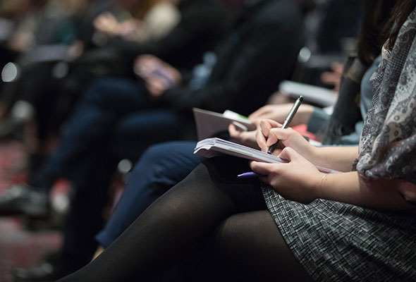 People at a presentation, an example of community involvement